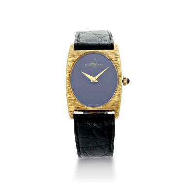 View full screen - View 1 of Lot 1056. REFERENCE 37073 A YELLOW GOLD OVAL WRISTWATCH WITH LAPIS LAZULI DIAL, CIRCA 1980.