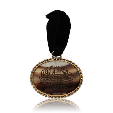 View full screen - View 1 of Lot 109. An engraved oval agate pendant.