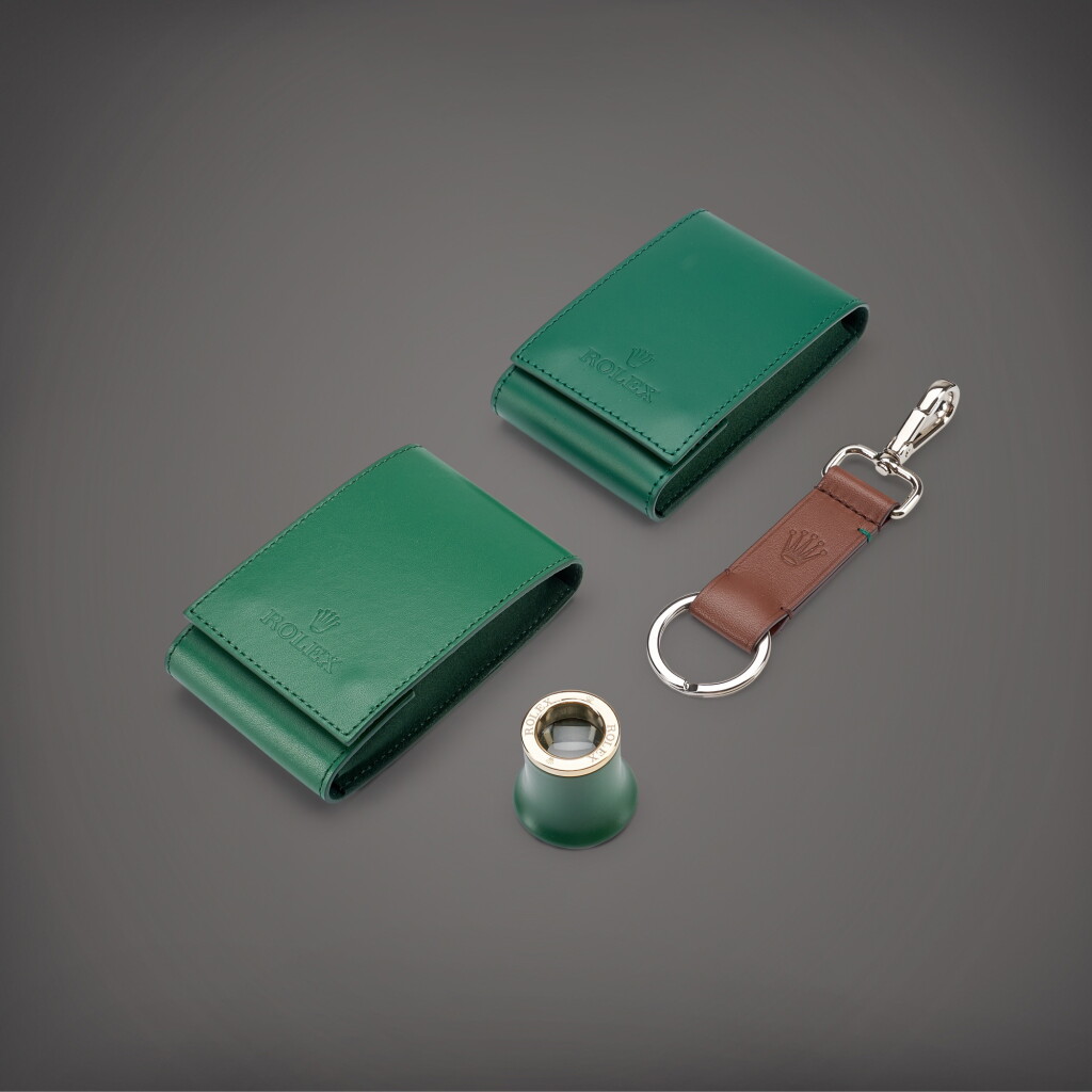 View full screen - View 1 of Lot 862. A set of magnifying loupe, keychain and two travelling pouches, Circa 2020 | 勞力士 | 一套放大鏡、鑰匙扣及兩件皮製旅行袋子,約2020年製.