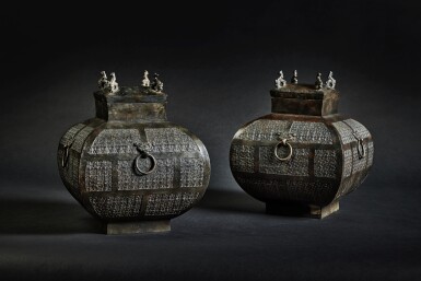 View full screen - View 1 of Lot 169. A pair of archaic bronze ritual wine vessels and covers (Fanghu), Eastern Zhou dynasty, Warring States period.