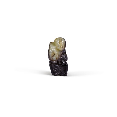 View full screen - View 1 of Lot 32. A small celadon and black jade figure of a boy holding a lotus Ming dynasty | 明 青玉持蓮童子.