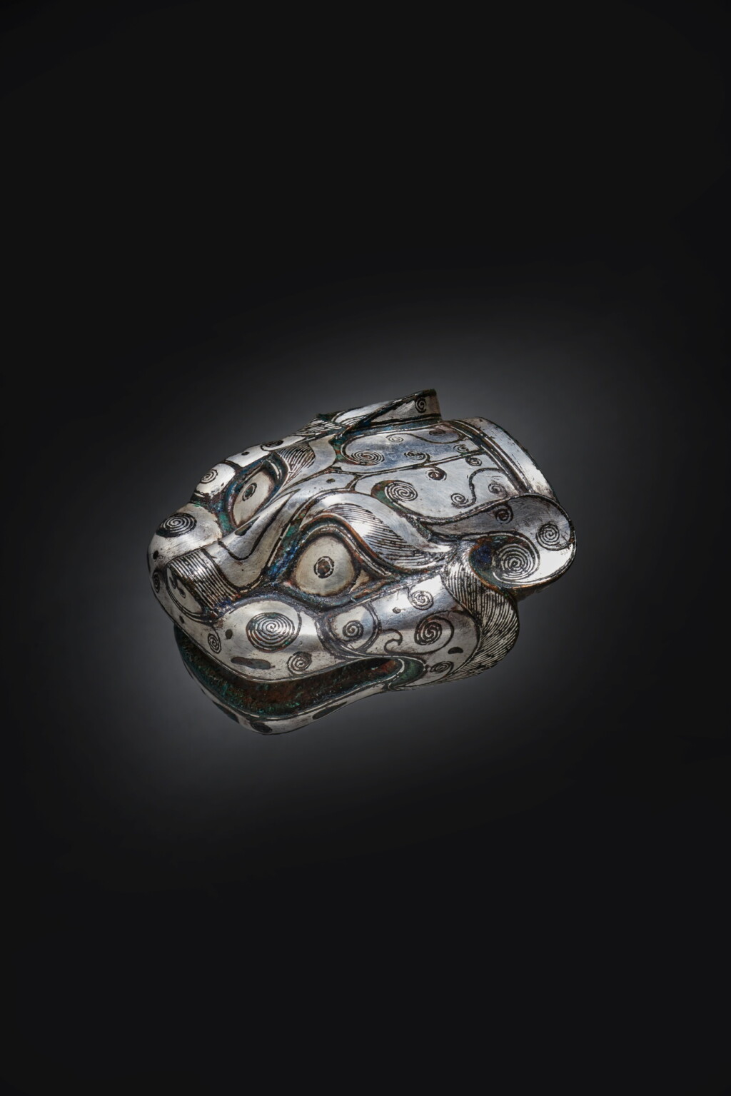View full screen - View 1 of Lot 165. A rare silver-inlaid bronze 'beast head' chariot ornament, Warring States period - Han dynasty.