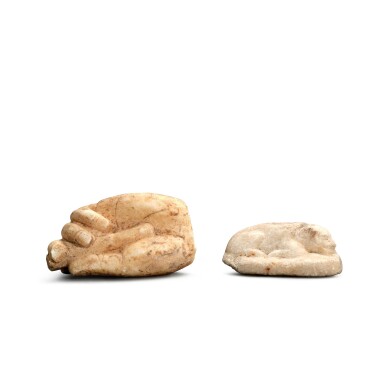 View full screen - View 1 of Lot 5503. A marble lion and a marble torso of a hand, Tang dynasty | 唐 大理石雕獅子像及手部殘件.
