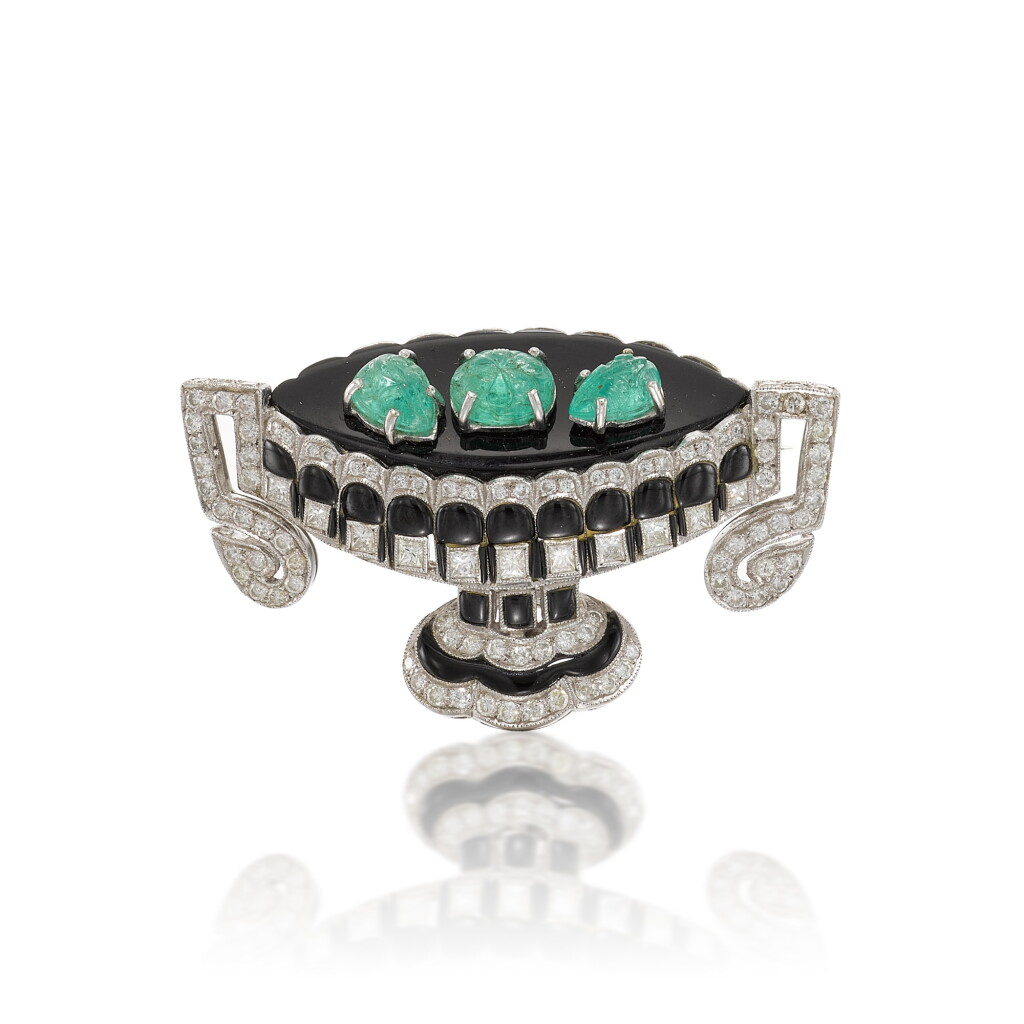 View full screen - View 1 of Lot 228. An emerald, onyx and diamond brooch.