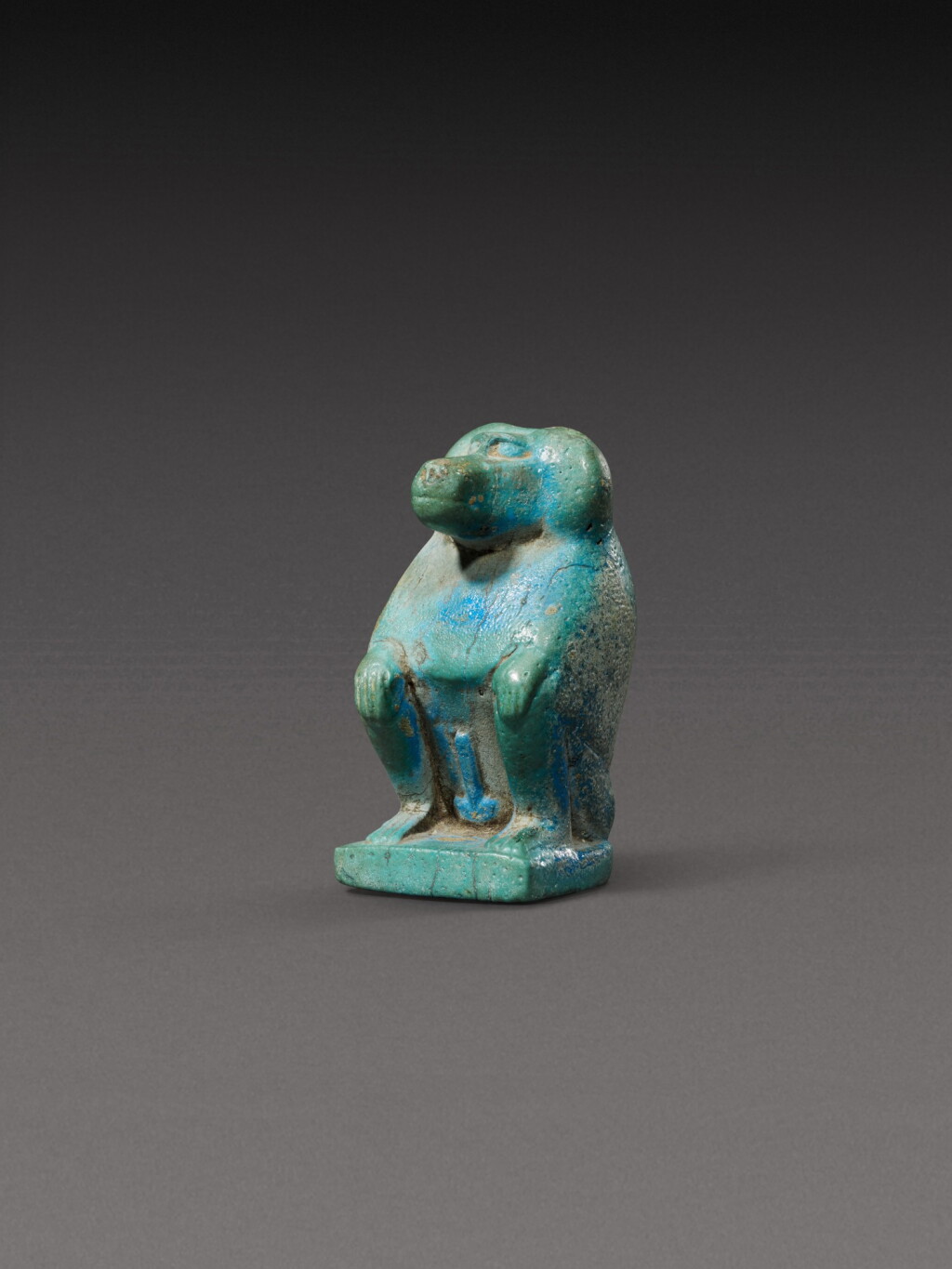 View full screen - View 1 of Lot 117. An Egyptian Turquoise Faience Figure of a Baboon, 12th/13th Dynasty, 1938-1640 B.C..