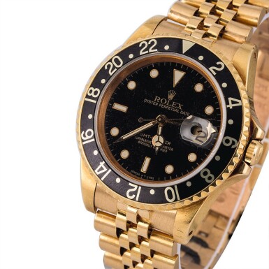 View full screen - View 1 of Lot 8. ROLEX | GMT-Master, Ref. 16758, A Yellow Gold Wristwatch with Bracelet Circa 1981.