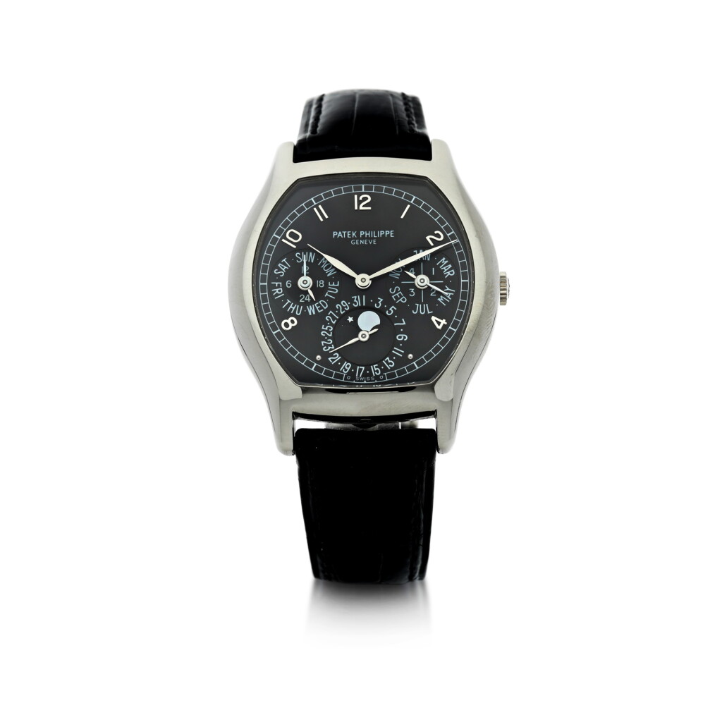 View full screen - View 1 of Lot 30. REFERENCE 5040G-016 A WHITE GOLD TONNEAU-SHAPED AUTOMATIC PERPETUAL CALENDAR WRISTWATCH WITH MOON PHASES, 24-HOUR AND LEAP YEAR INDICATION, CIRCA 2002.