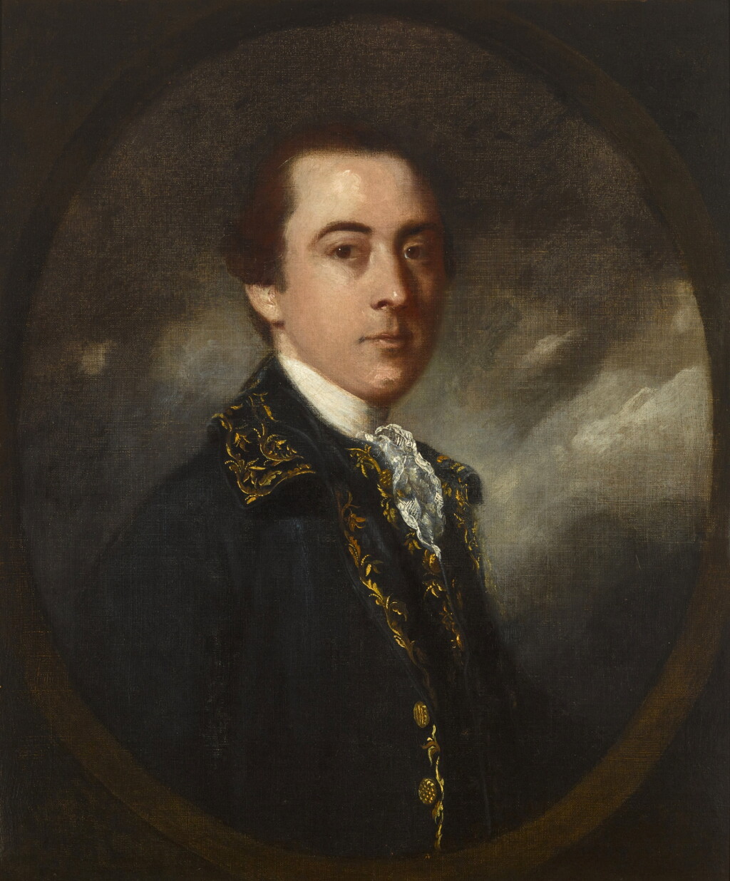 View full screen - View 1 of Lot 213. Portrait of a man in a blue embroidered coat and lace cravat, in a painted oval.