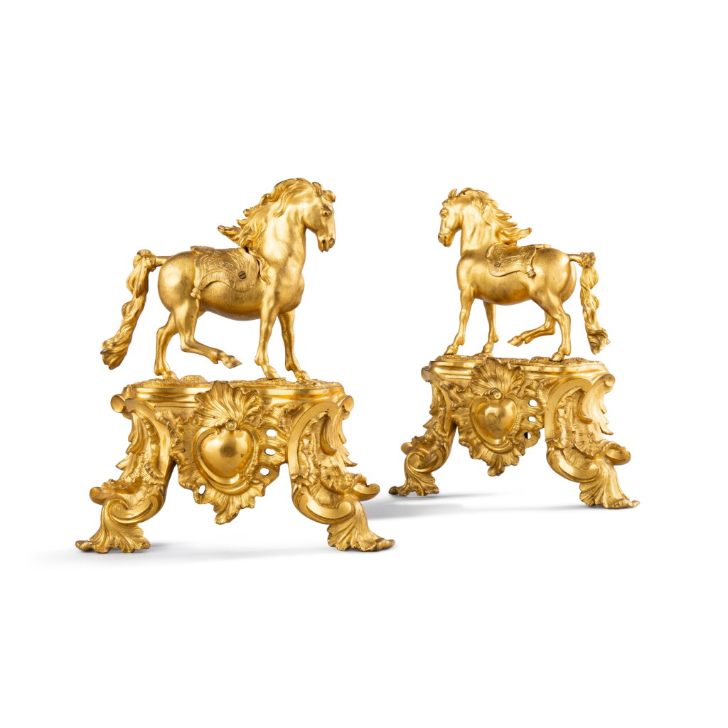 View full screen - View 1 of Lot 617. A pair of early Louis XV gilt-bronze figural chenets, circa 1730.