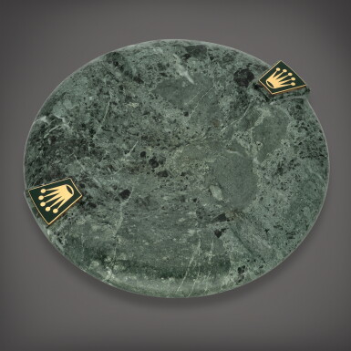 View full screen - View 1 of Lot 649. Green marble round ashtray with applied Rolex coronet emblems and baize underside | Circa 1970.