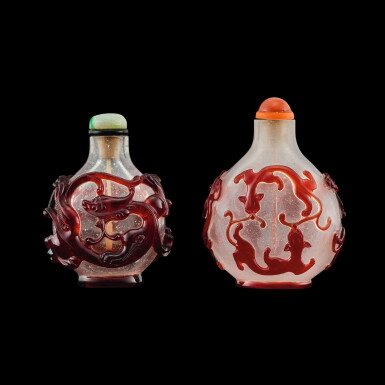 View full screen - View 1 of Lot 1105. Two ruby-red overlay glass 'chilong' snuff bottles, Qing dynasty, 18th - 19th century | 清十八至十九世紀 套寶石紅料螭龍紋鼻煙壺一組兩件.