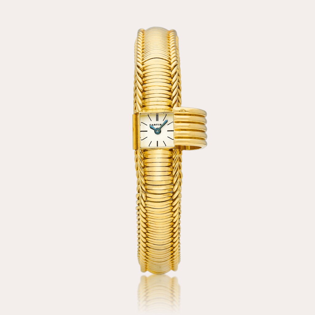 View full screen - View 1 of Lot 2181. A yellow gold bracelet watch with concealed dial, Circa 1965 | 卡地亞 | 黃金鏈帶腕錶,備隱藏式錶盤,約1965年製.