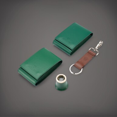View full screen - View 1 of Lot 862. A set of magnifying loupe, keychain and two travelling pouches, Circa 2020 | 勞力士 | 一套放大鏡、鑰匙扣及兩件皮製旅行袋子,約2020年製.