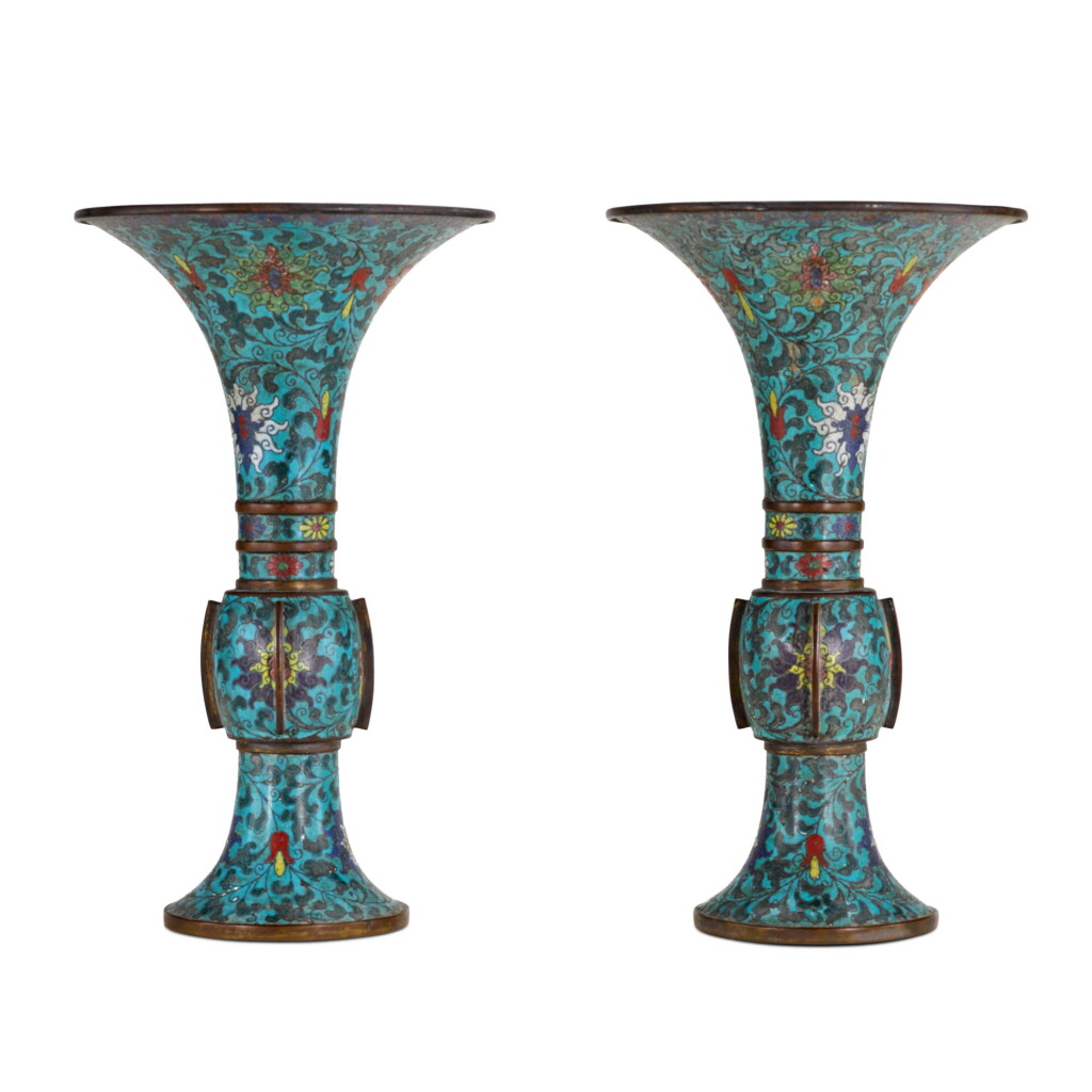 View full screen - View 1 of Lot 57. A pair of cloisonné enamel beaker vases, gu, Early Qing dynasty | 清初 掐絲琺瑯纏枝蓮紋出戟花觚一對.