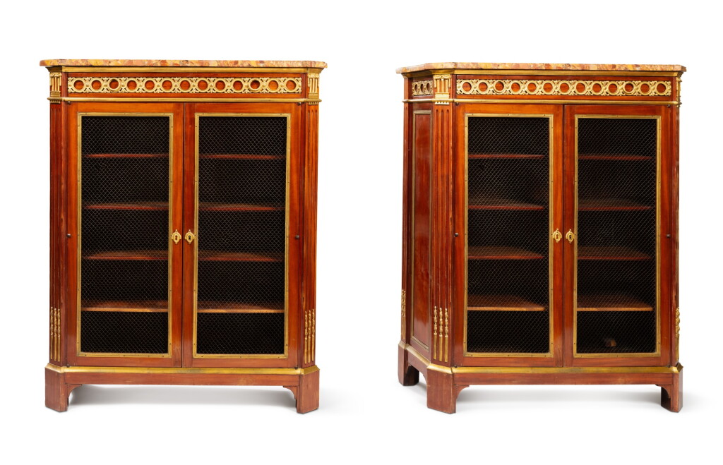 View full screen - View 1 of Lot 128. A pair of Louis XVI gilt-bronze mounted and mahogany book-cases, circa 1780.