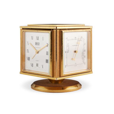 View full screen - View 1 of Lot 91. A gilt brass 8 day desk compendium with day and date, alarm, thermometer, barometer, and hygrometer, Circa 1950.