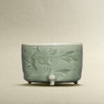A Longquan celadon-glazed incised 'floral' tripod incense burner, Ming dynasty | 明 龍泉青釉劃花草紋三足爐