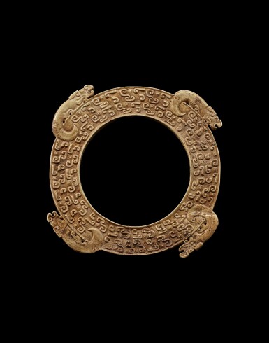 View full screen - View 1 of Lot 911. A rare jade ‘mythical beast’ flanged disc, Eastern Zhou dynasty, late Spring and Autumn period | 東周春秋晚期 四獸出廓玉璧.