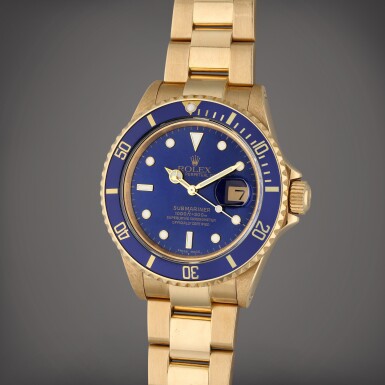 View full screen - View 1 of Lot 437. Reference 16808 Submariner | A yellow gold automatic wristwatch with date and bracelet, Circa 1987.