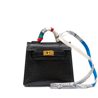 View full screen - View 1 of Lot 1200. Black Shiny Niloticus Lizard Micro Mini Twilly Kelly Bag Charm Palladium Hardware, 2022.