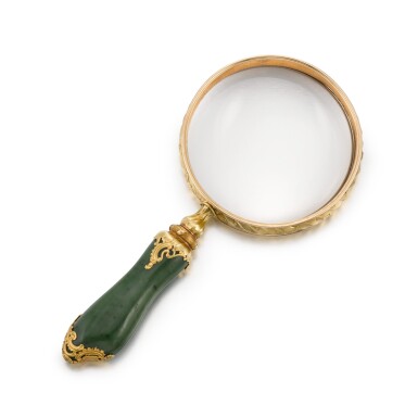 View full screen - View 1 of Lot 403. A Fabergé gold-mounted nephrite magnifying glass, workmaster Michael Perkhin, St Petersburg, circa 1890.