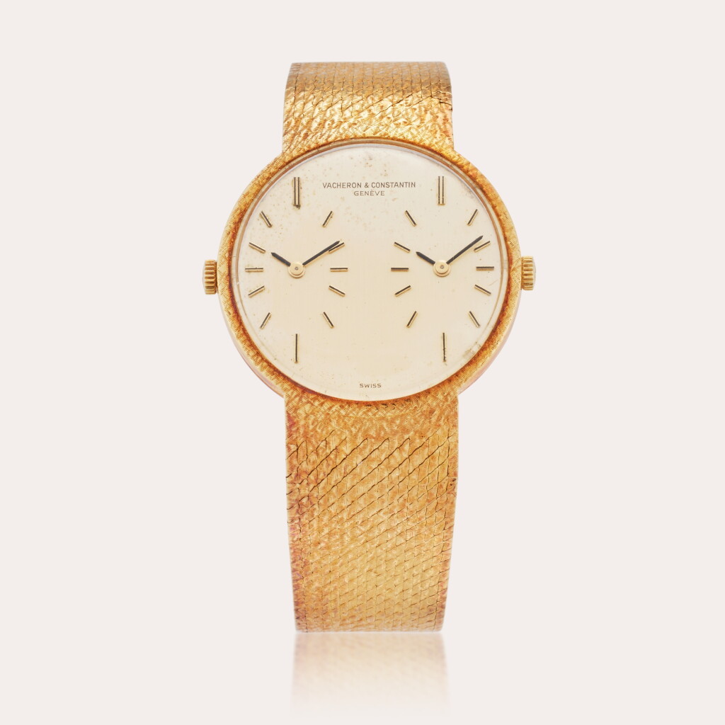 View full screen - View 1 of Lot 391. Reference 35004 Patrimony Dual Time | A yellow gold dual time bracelet watch, Circa 1985.