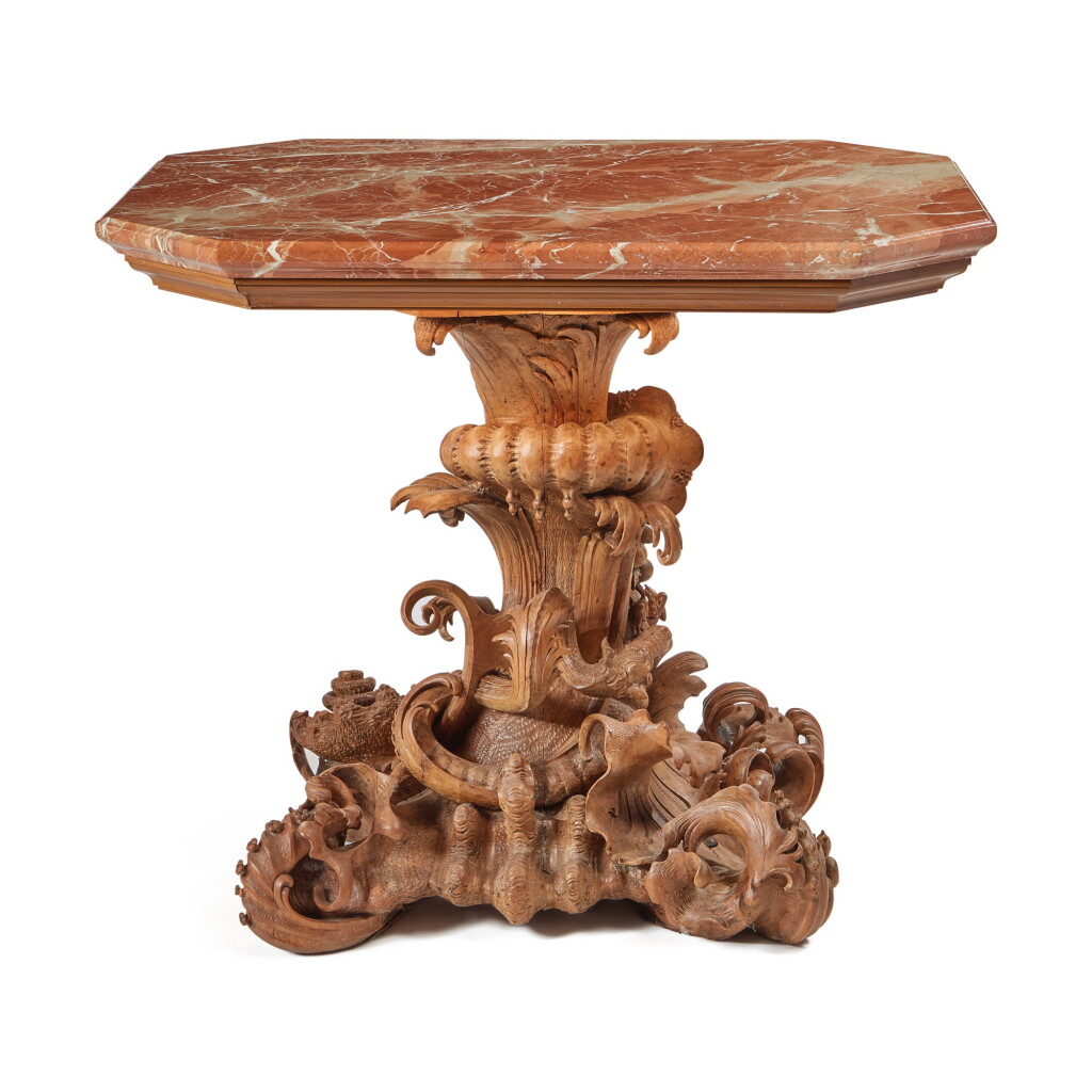 View full screen - View 1 of Lot 135. A German Rococo Stand carved with dragons, shellwork and a cornucopia.