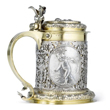 View full screen - View 1 of Lot 72. A LARGE GERMAN PARCEL-GILT SILVER FOUR SEASONS TANKARD, JOHANN PHILIPP HÖFLER, NUREMBERG, CIRCA 1700.