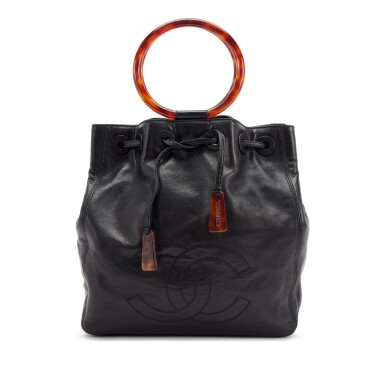 View full screen - View 1 of Lot 142. Black Lambskin CC Drawstring Ring Handle Bag Tortoiseshell Bakelite Hardware, 1997-1999.