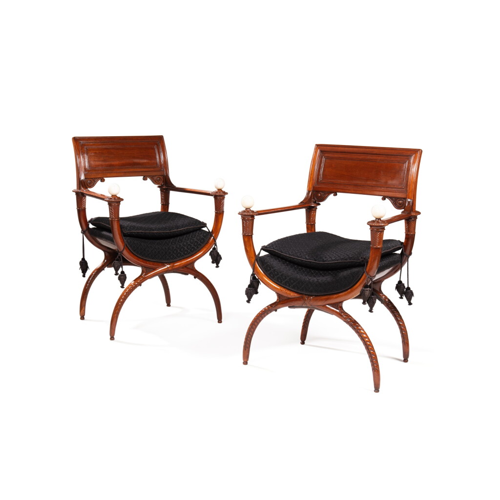 View full screen - View 1 of Lot 588. A pair of Louis XVI mahogany and ivory 'curule' armchairs, late 18th century, attributed to Georges Jacob.