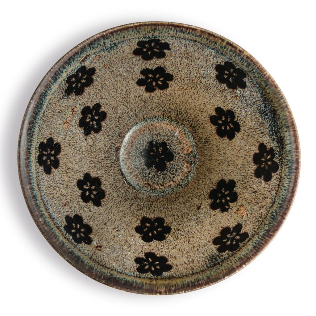 View full screen - View 1 of Lot 102. A 'Jizhou' 'papercut' bowl, Southern Song dynasty | 南宋 吉州窰剪紙貼花梅花紋盌.