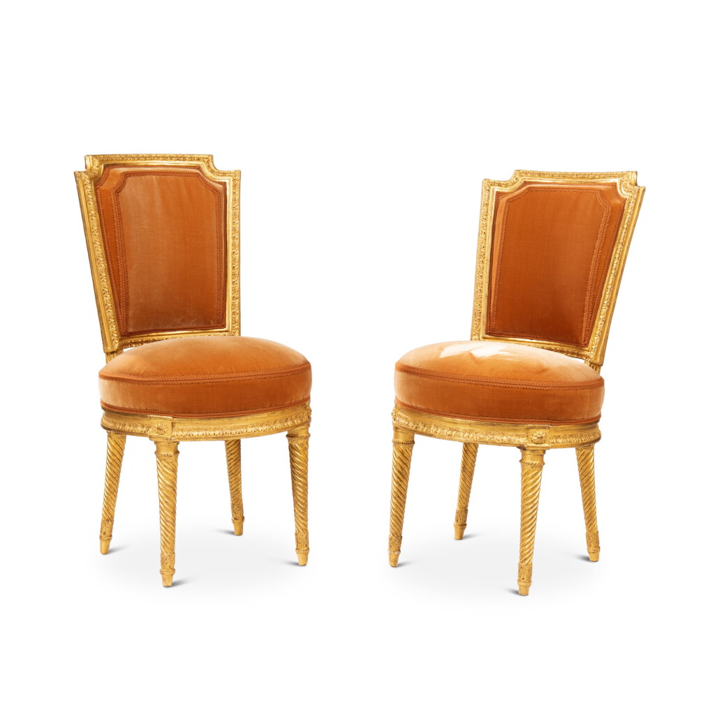 View full screen - View 1 of Lot 576. A pair of Louis XVI chaises en cabriolet, late 18th century, attributed to Georges Jacob.