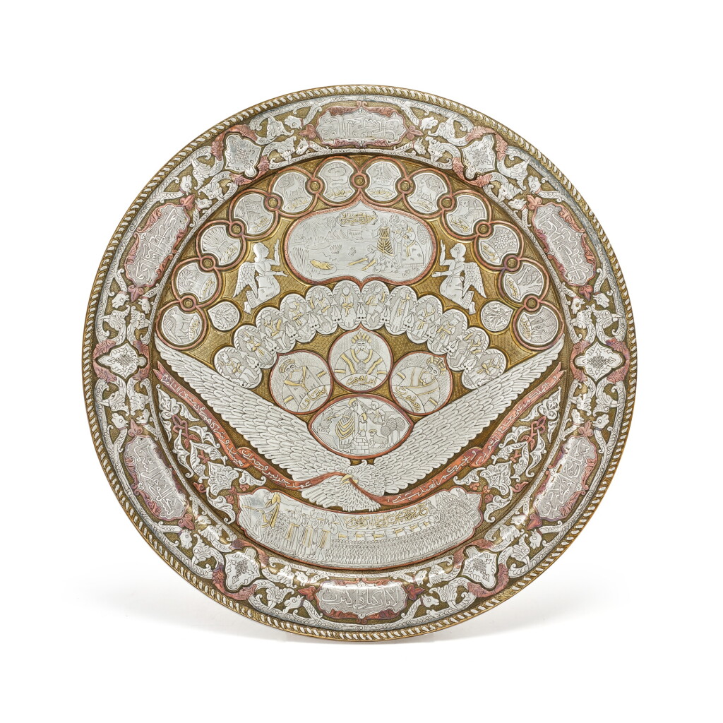 View full screen - View 1 of Lot 28. A Damascened Silver, Copper and Gold Plate with Old Testament Scenes, signed Jadid and Joubran Na'assan and partners, Damascus, dated 1901.