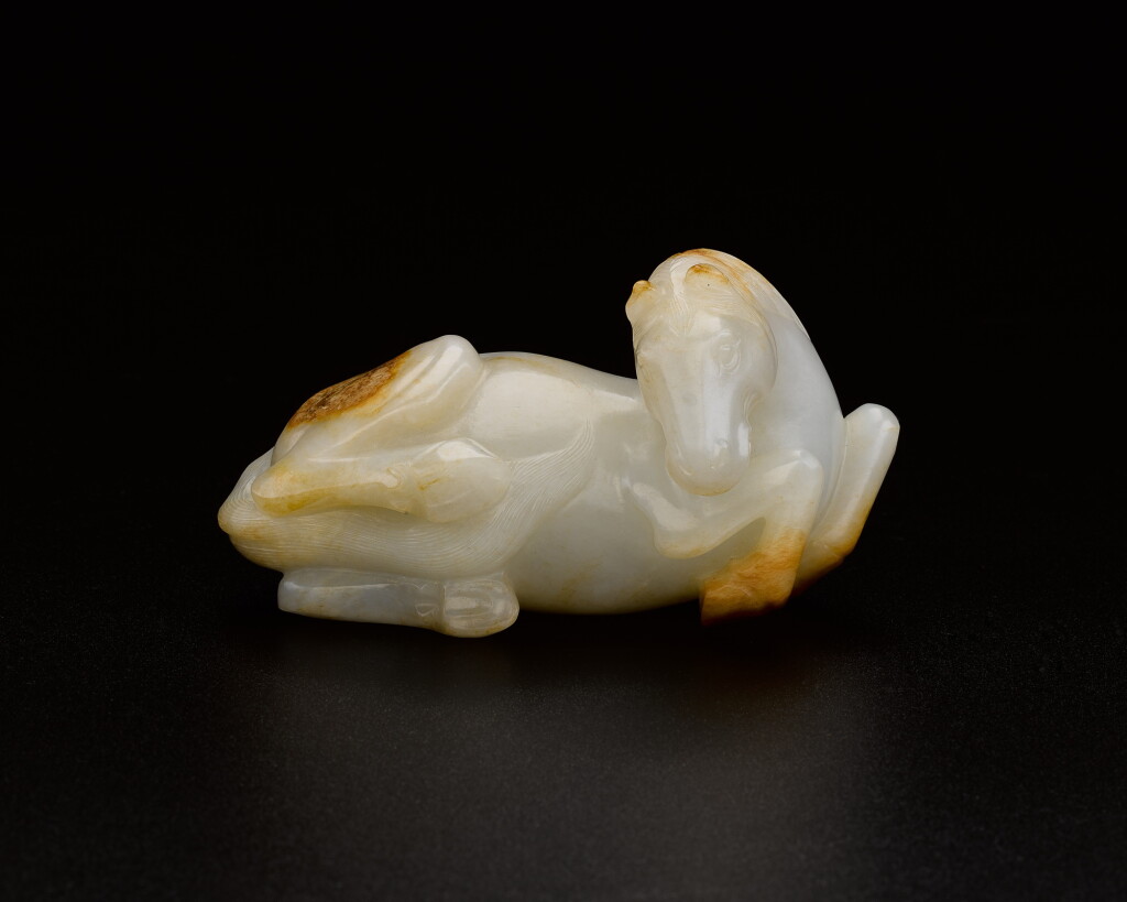 View full screen - View 1 of Lot 193. A white jade figure of a horse, Qing dynasty, Qianlong period | 清乾隆 白玉臥馬.