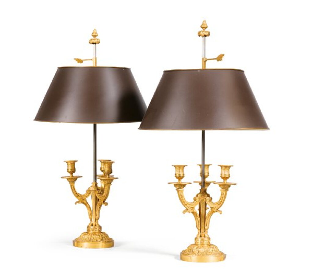 View full screen - View 1 of Lot 79. A pair of Louis XVI style gilt-bronze lampes bouillotte, after a model by Charles Delafosse.