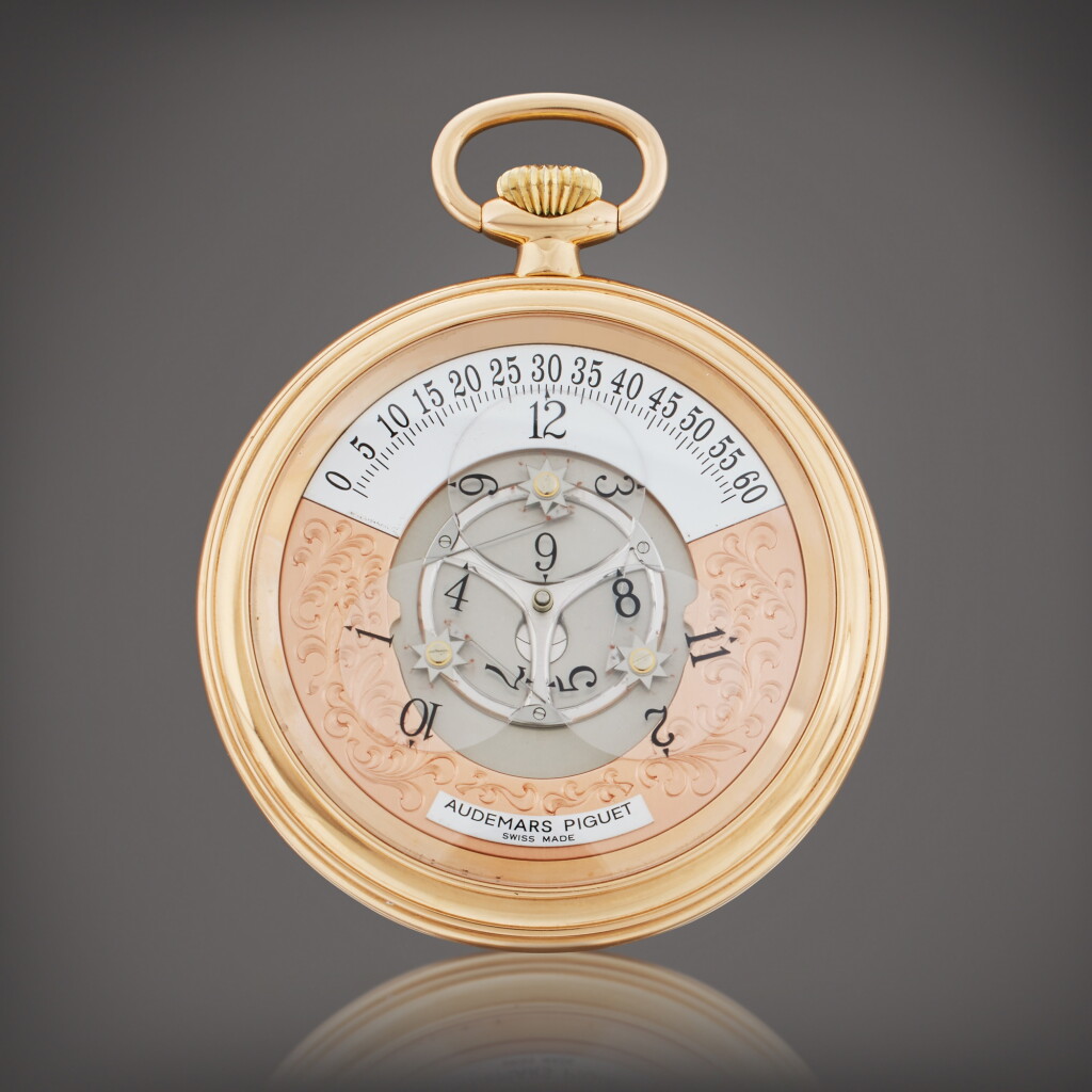 View full screen - View 1 of Lot 123. Star Wheel | A pink gold open faced semi-skeletonized wristwatch with satellite hour display, Circa 1995.
