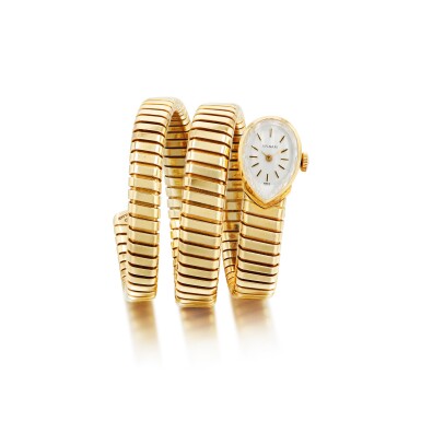 View full screen - View 1 of Lot 780. Bulgari | Montre de dame or, "Serpenti" | Lady's gold bracelet watch, 'Serpenti'.
