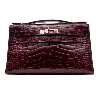 View full screen - View 1 of Lot 1343. Bordeux Shiny Alligator Kelly Pochette Palladium Hardware, 2010.