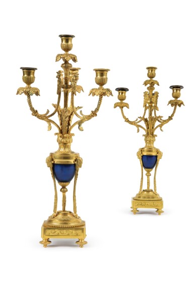 View full screen - View 1 of Lot 240. A PAIR OF LOUIS XVI STYLE GILT BRONZE AND BLUED STEEL FOUR-LIGHT CANDELABRA.