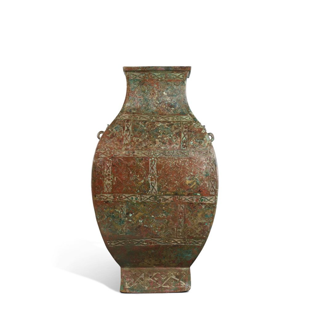 View full screen - View 1 of Lot 3595. A copper-inlaid bronze wine vessel, hu, Eastern Zhou dynasty, Warring States period | 東周戰國 青銅嵌紅銅幾何紋方壺.