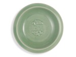 A Longquan celadon 'twin fish' dish, Southern Song dynasty | 南宋 龍泉青釉雙魚折沿盤