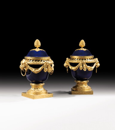 View full screen - View 1 of Lot 117. A pair of Louis XVI style gilt-bronze mounted Sèvres porcelain pot-pourri vases, after a model by Jean Dulac, late 19th century.