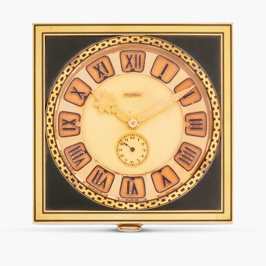 View full screen - View 1 of Lot 119. A yellow gold, enamel and onyx travel alarm clock with two-tone France dial, Circa 1930.