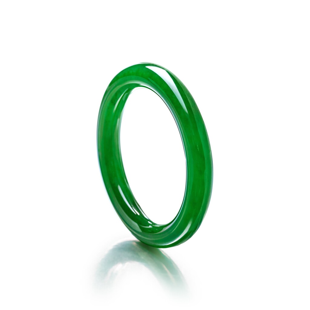 View full screen - View 1 of Lot 1837. A Very Rare and Impressive Jadeite Bangle | 珍罕奪目 天然满色翡翠手鐲.