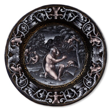 View full screen - View 1 of Lot 120. A Limoges grisaille painted enamel plate depicting Cupid fleeing from Psyche, Attributed to Pierre Reymond (1513-1584) circa 1570-1577.