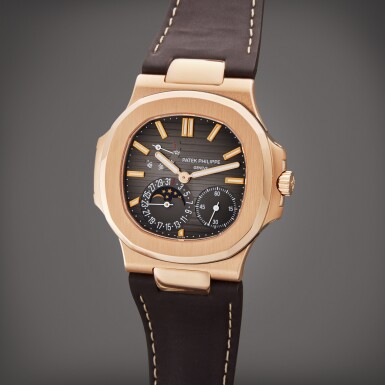 View full screen - View 1 of Lot 22. Reference 5712 Nautilus | A pink gold automatic wristwatch with date, power reserve indication and moon phases, Circa 2015.