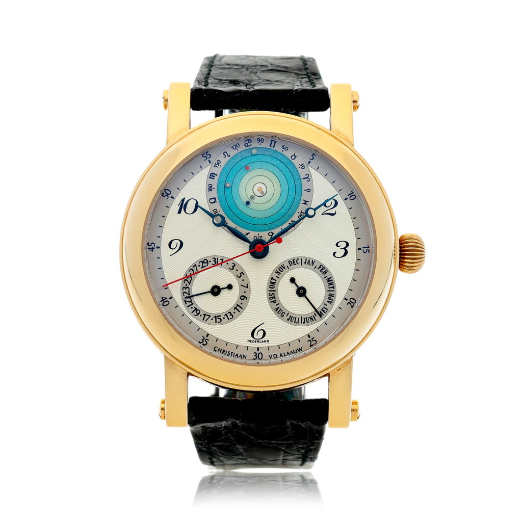 View full screen - View 1 of Lot 61. CHRISTIAAN VAN DER KLAAUW | PLANETARIUM 2000 A YELLOW GOLD AUTOMATIC WRISTWATCH WITH MONTH, DATE, AND PLANETARIUM APERTURE DEPICTING THE RELATIVE PLACEMENT OF THE PLANETS AROUND THE SUN, CIRCA 2000.
