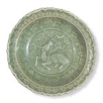 A rare molded 'Longquan' celadon-glazed 'Xiniu and Moon' dish, Yuan dynasty