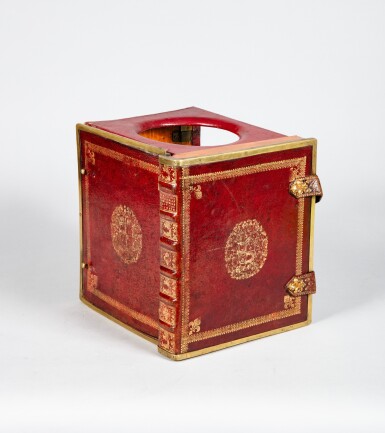 View full screen - View 1 of Lot 637. A leather binding with the Dauphin's coat-of-arms travelling chaise percée, late 17th-early 18th century | Chaise percée de voyage en maroquin rouge et bronze doré aux armes du Dauphin de France, fin du XVIIe-milieu du XVIIIe siècle.