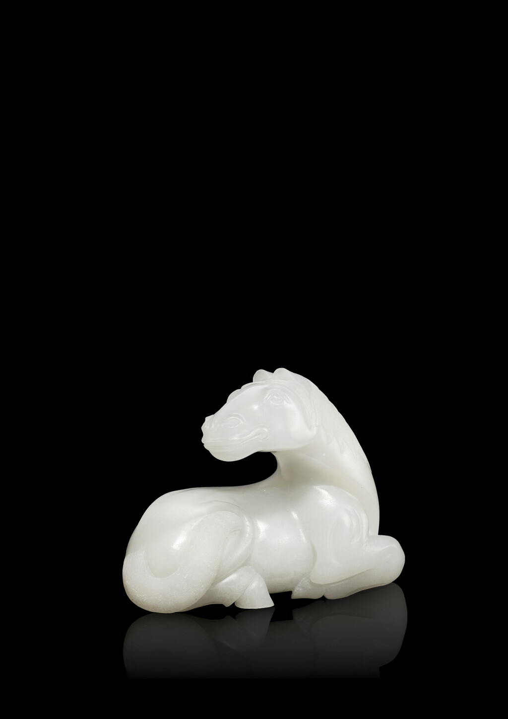View full screen - View 1 of Lot 3620. A white jade figure of a recumbent horse, Qing dynasty, 18th century | 清十八世紀 白玉臥馬.